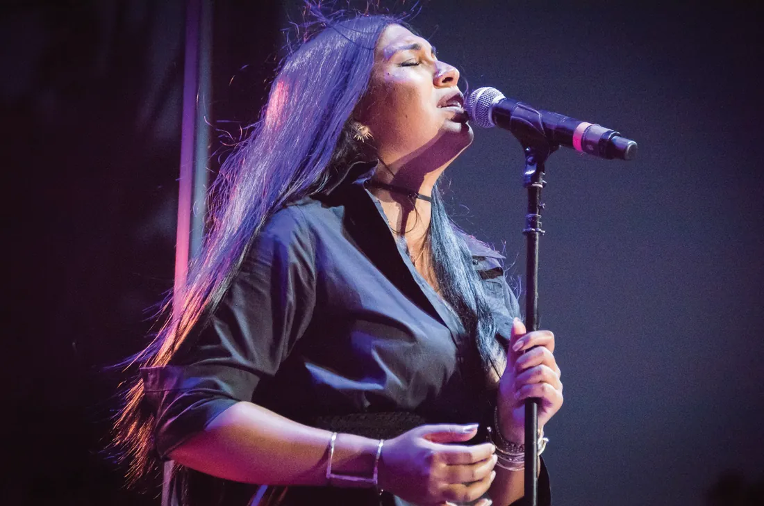 Vocalist mid-performance on the FM R&B LIVE stage